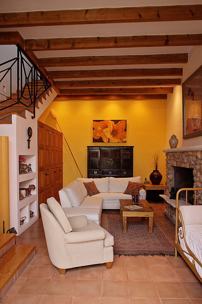 Living room with oriental armoire and wall with three closets